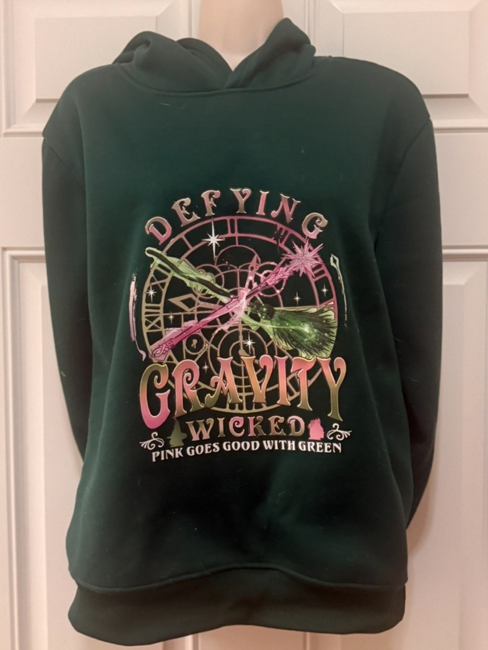 Wicked 'Defying Gravity' Graphic Hoodie - Dark Green, S